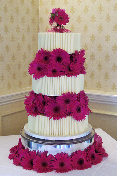 Clover shaped wedding cake fresh flowers with butterflies